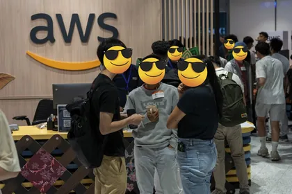 Attendees talking in front of the AWS sign at the OpenClaw Meetup in Kuala Lumpur